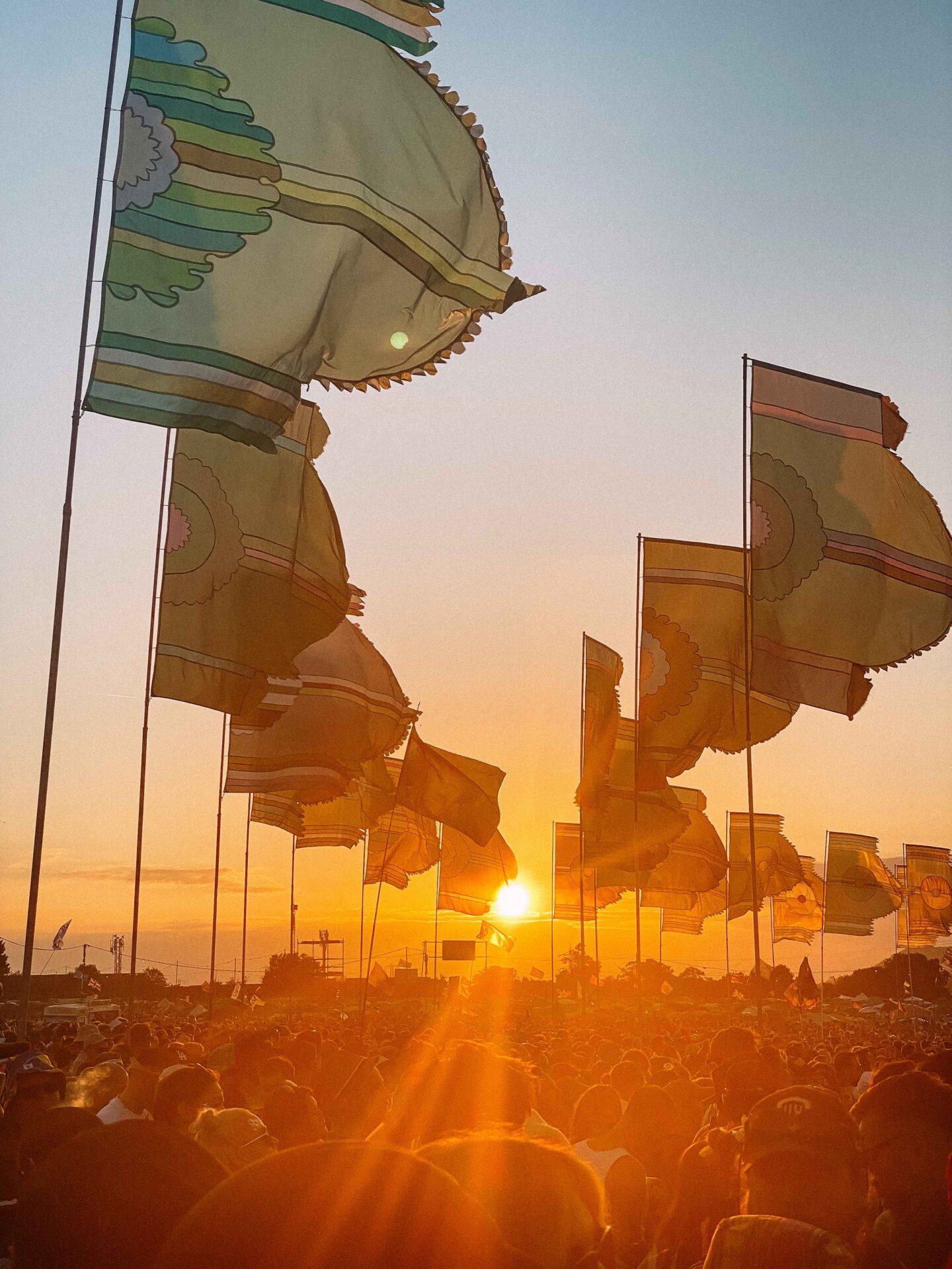 Glastonbury flags at sunset