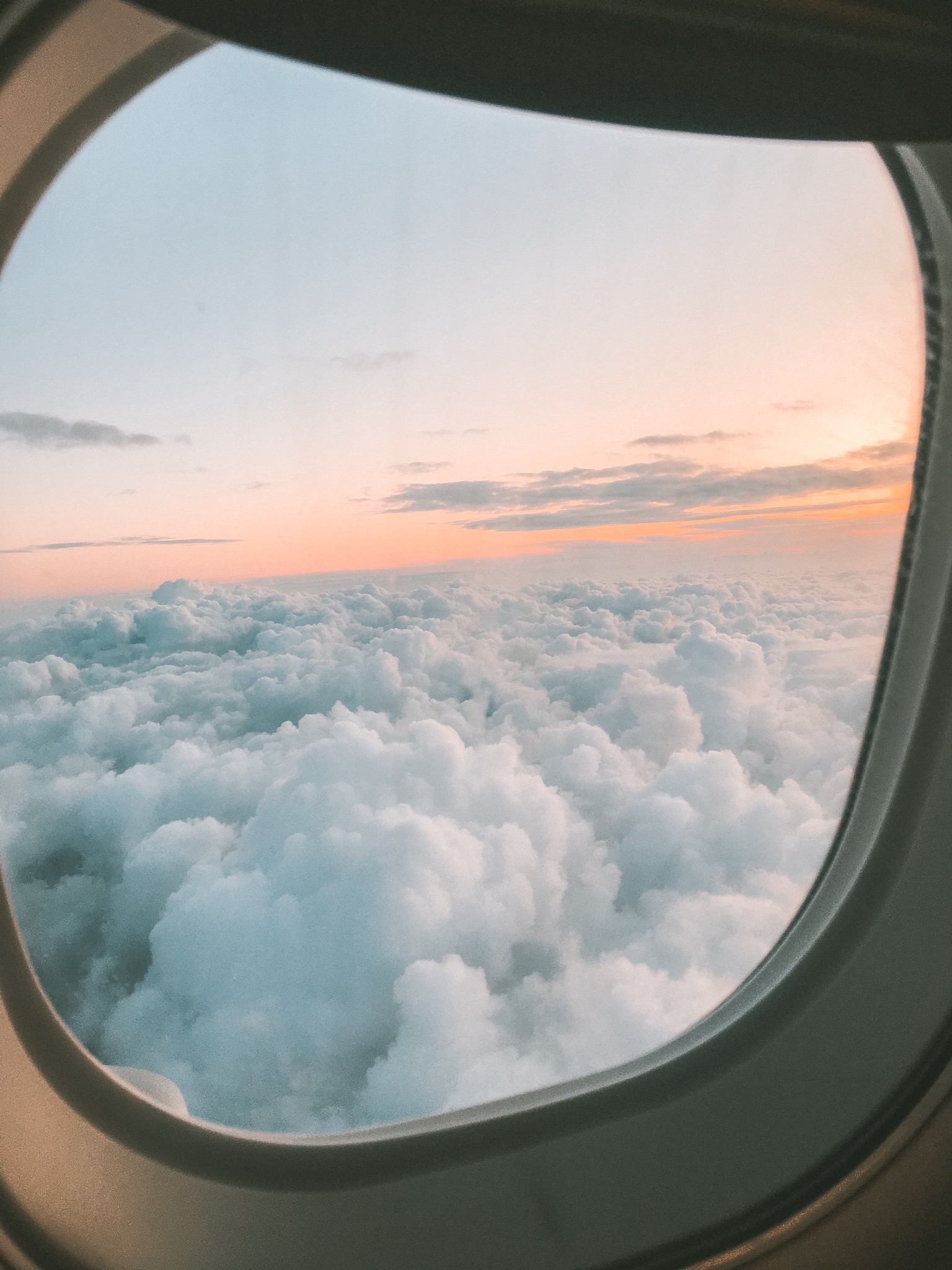 View from airplane window at sunrise